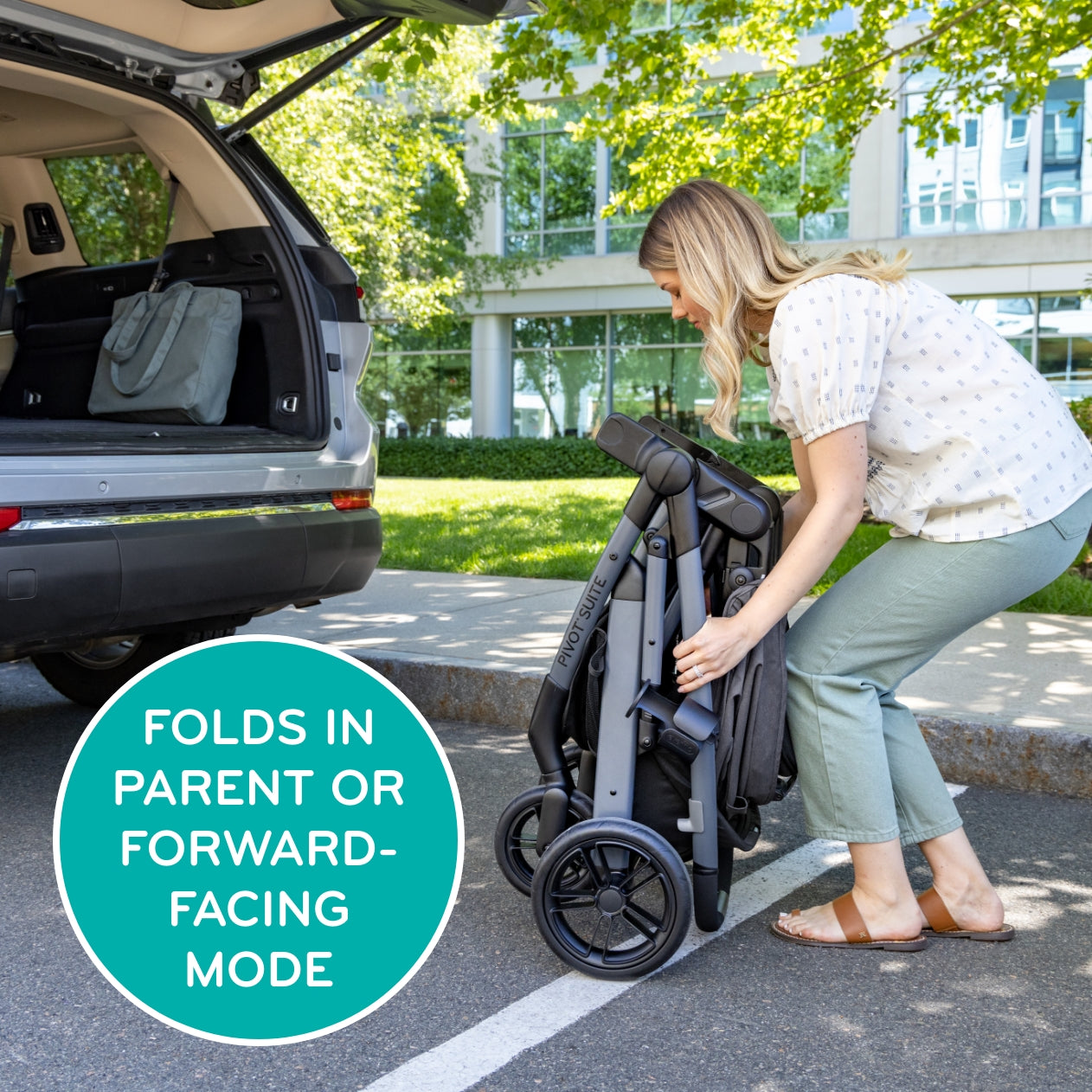 Folds in parent or forward-facing mode. Image of mom folding Pivot Suite next to a car trunk.