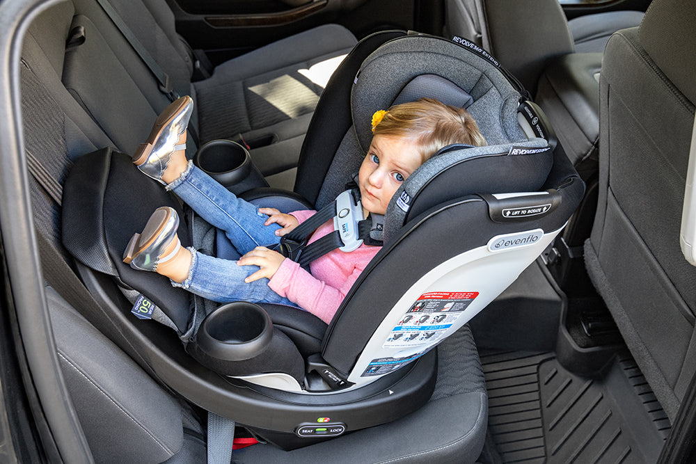 Image of child in rear-facing Revolve360 Extend Car Seat.