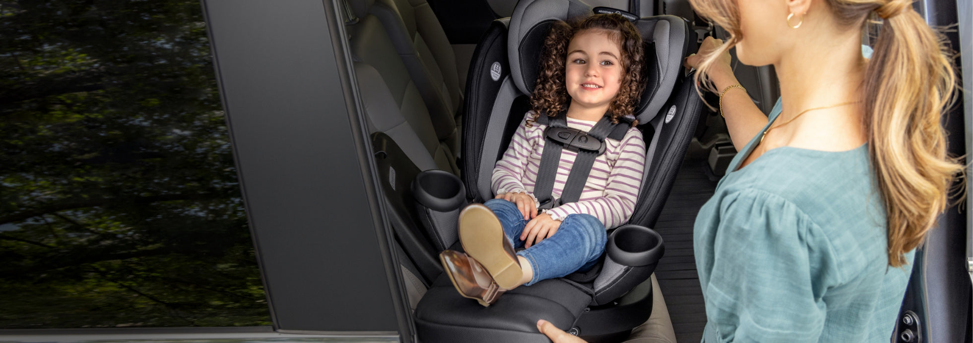 child sitting in Evenflo all-in-one car seat  