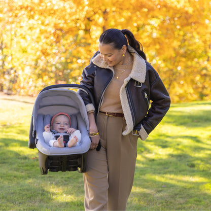 Evenflo Revolve180 LiteMax NXT Rotating Infant Car Seat with SensorySoothe mom carry