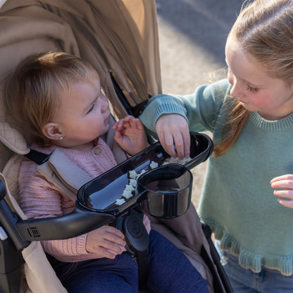 Shyft Intuiti+ Stroller with Green & Gentle Fabric Quartz eating on the go