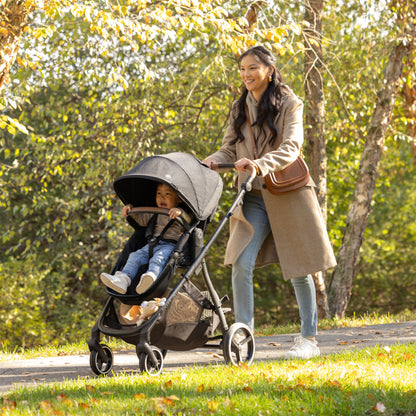 Shyft Intuiti Travel System with Revolve180 LiteMax NXT Rotating Infant Car Seat Black Shale walking