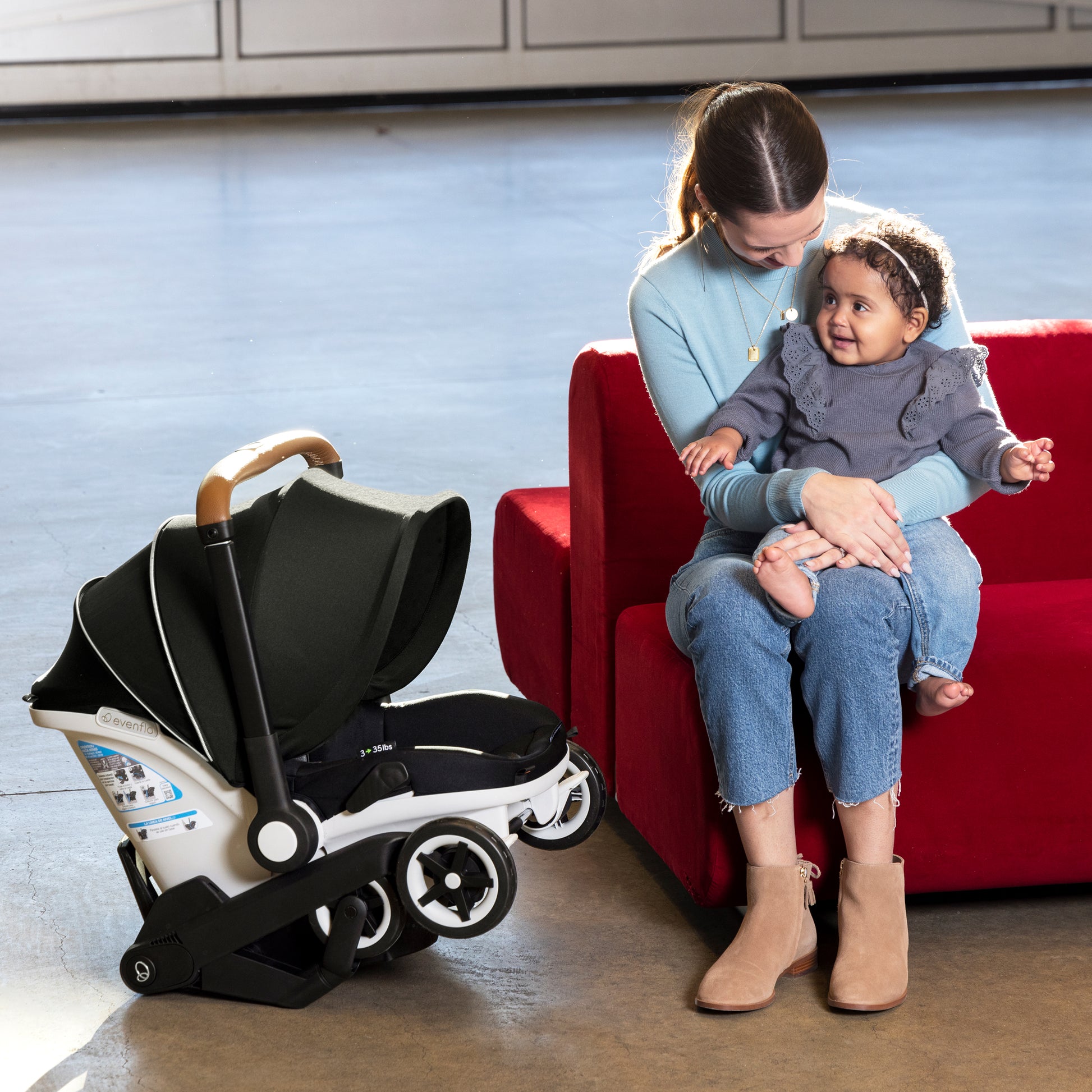 https://www.evenflo.com/cdn/shop/products/37312311_46_Gold_Shyft_DualRide_Infant_Car_Seat_and_Stroller_Combo_with_Carryall_Storage_Bag_Moonstone_Lifestyle_ICS_Carry_Wheels_Base.jpg?v=1697833363&width=1946